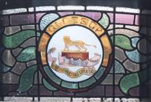 Stained glass window showing the Howard Lion