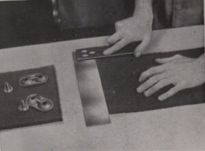 Photograph of instructions for fixing belt fasteners - step 1