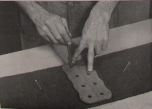 Photograph of instructions for fixing belt fasteners - step 3