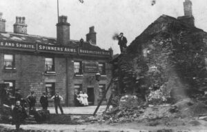 Photograph of buildings in front of the Spinners Arms, Hadfield