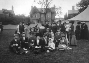 Photograph of people having a picnic at the Grand Fete in Glossop Park 1911