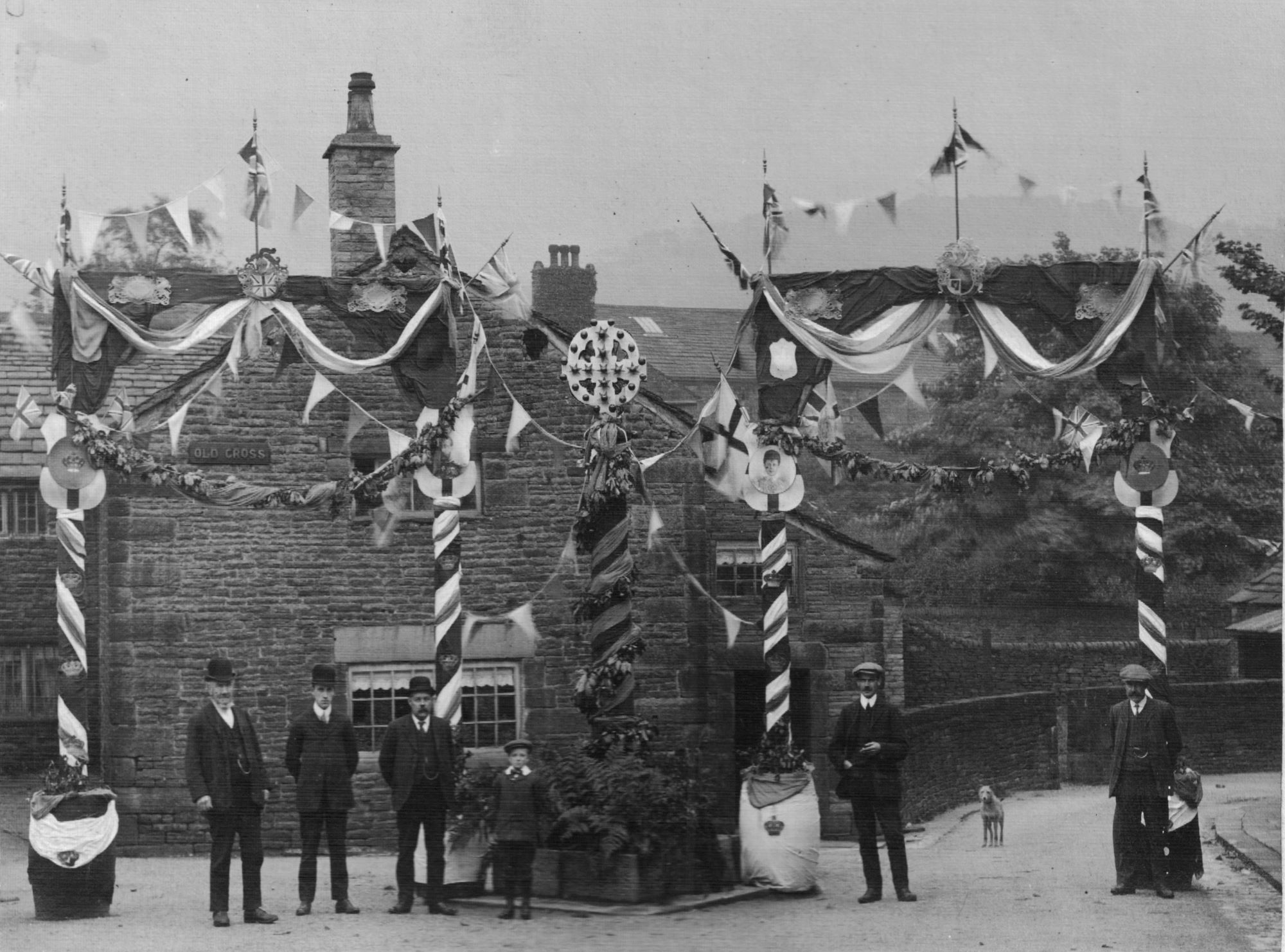 Photograph of the Old Cross, Old Glossop decorated for the Coronation 1911