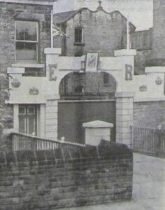 Photograph of the entrance to Sumner's Mill for the Coronation 1953