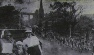 Photograph of the Coronation procession passing Dinting 1953