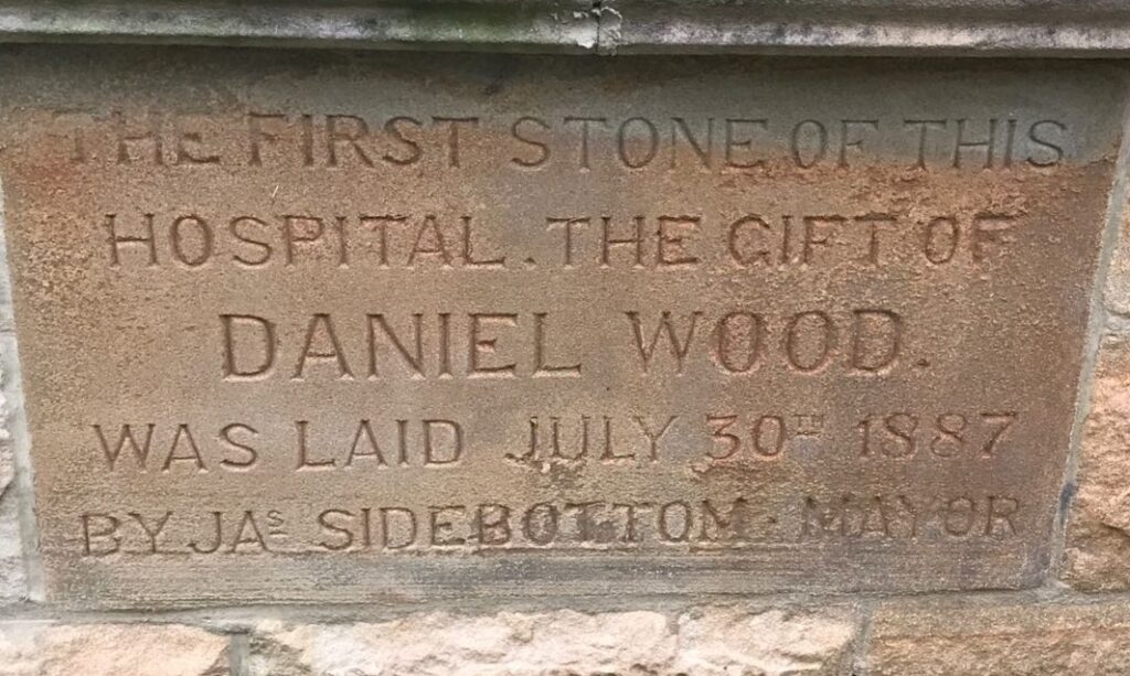 Photograph of the foundation stone of Wood's Hospital, Glossop
