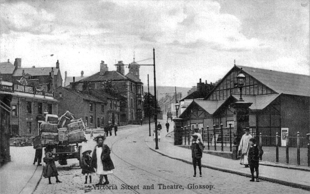 A black and white postcard of Victoria Street, Glossop in 1906