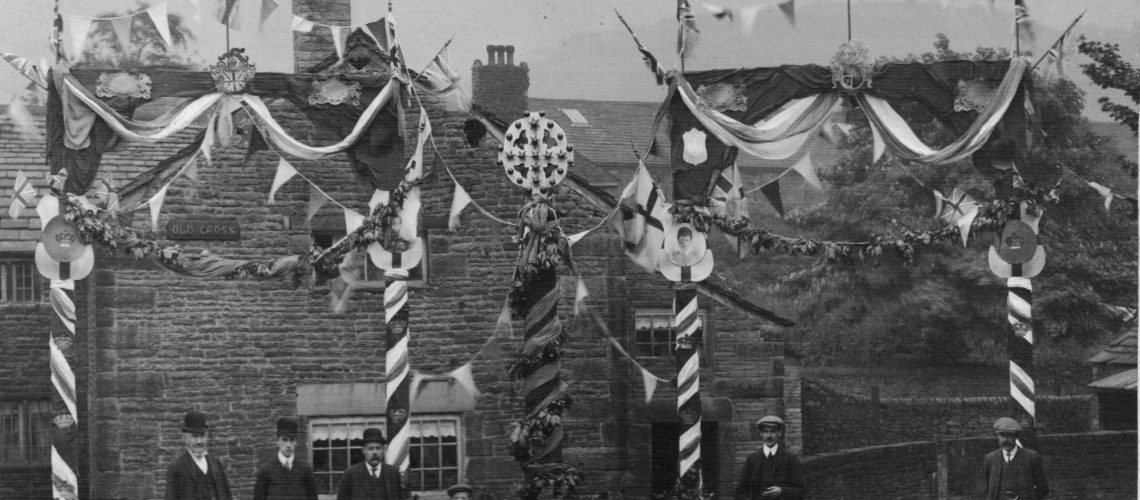 Photograph of the Old Cross, Old Glossop decorated for the Coronation 1911